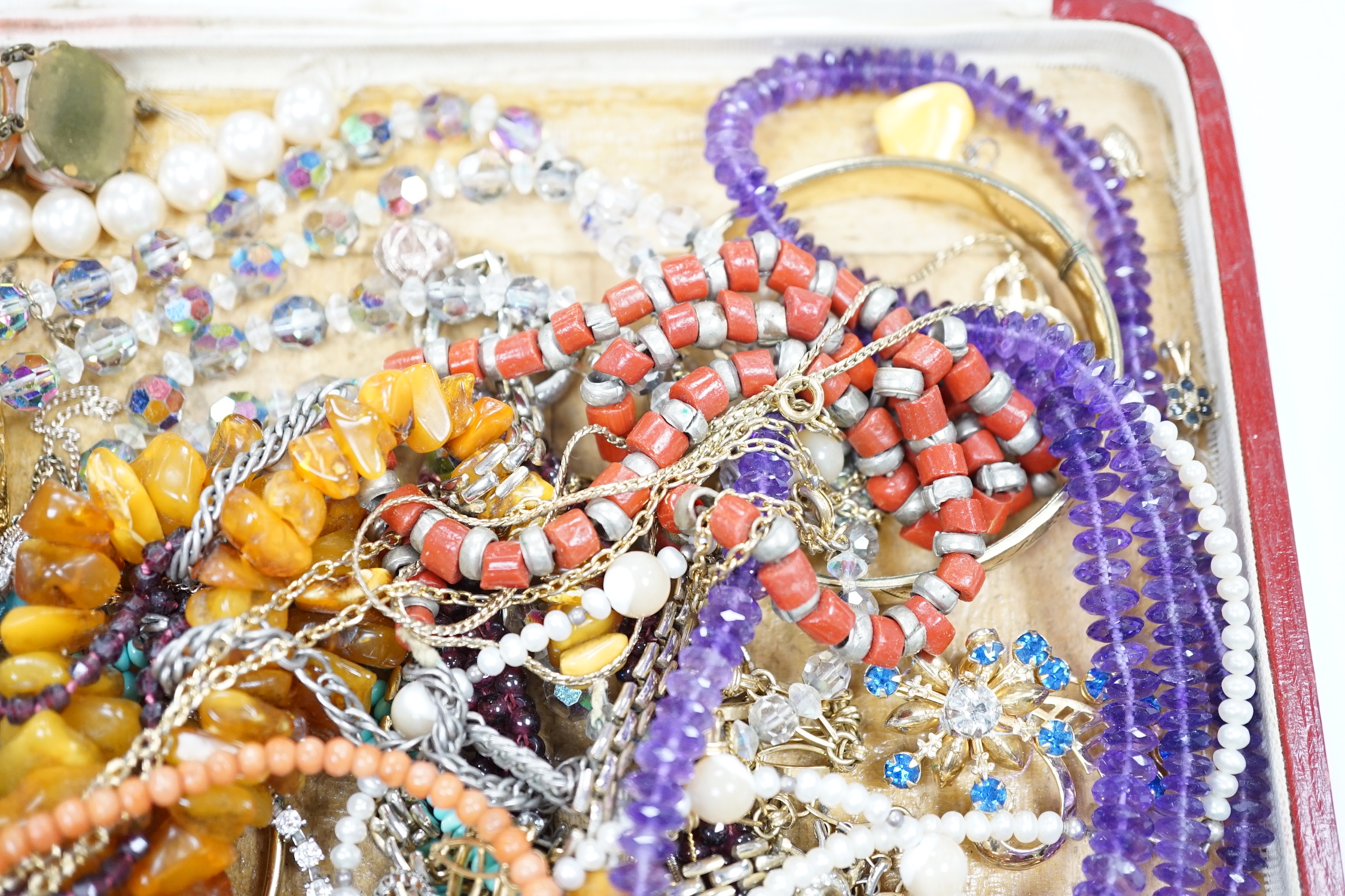 Assorted costume jewellery including amber necklace, coral necklace, cameo shell bracelet etc.